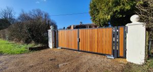 Automated Electric Timber driveway gate installation in Horsham Sussex, Oxted Surrey, Brighton